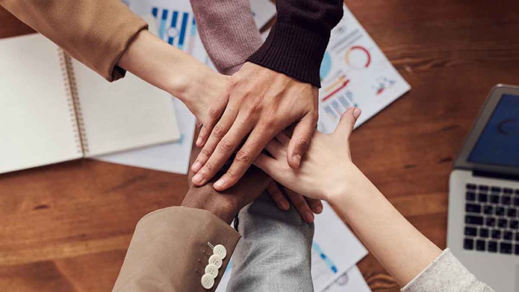 Group of hands on top of each other