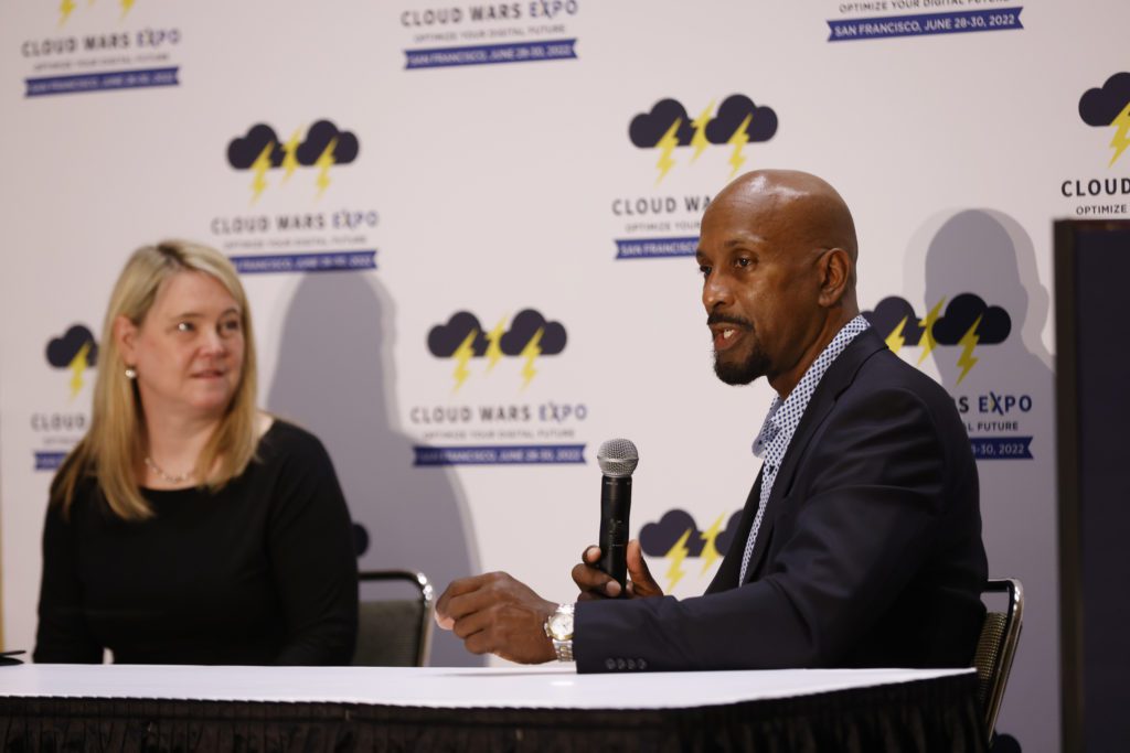 Microsoft representatives Lindsay Berg (left) and Christian Sarafidis (right) answer questions at the Industry Cloud Battleground for Financial Services at Cloud Wars Expo.