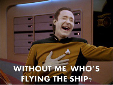 Data flying the ship