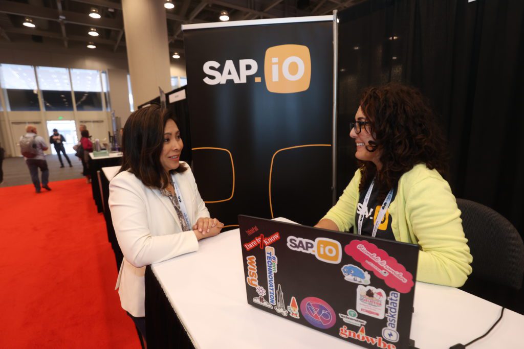 Wisy founder and CEO Min Chen (left) rehearses a few prepared remarks for her upcoming presentation on the Innovation Path stage. 